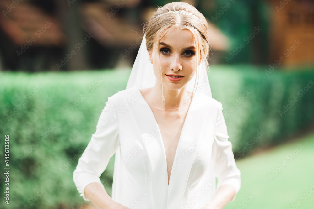 Beautiful fashion bride in wedding dress posing