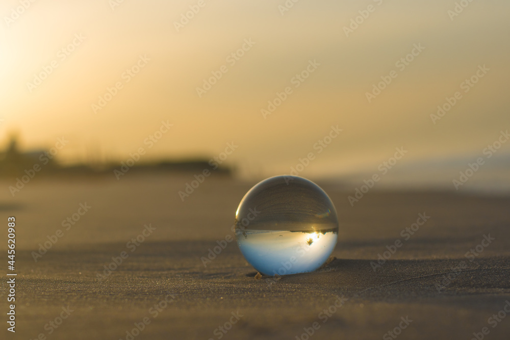 glass sphere on the beach glass sphere on the beach