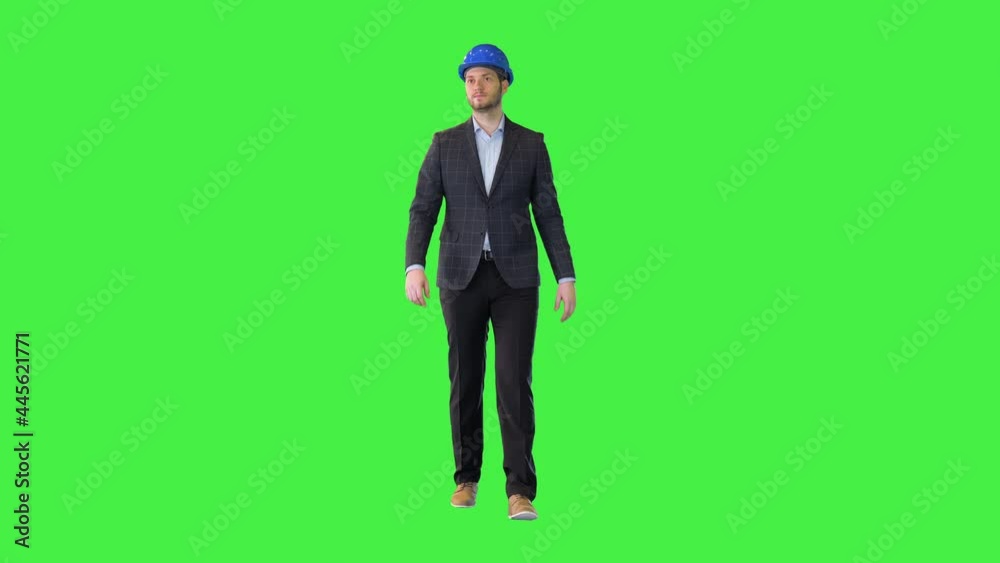 Confident building construction inspector walk Successful architect or designer in suit and helmet on a Green Screen, Chroma Key. Confident building construction inspector walk Successful architect or designer in suit and helmet on a Green Screen, Chroma Key.