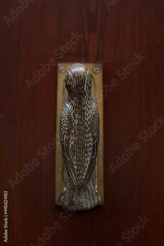 Embellishment bronze bird knocker in door