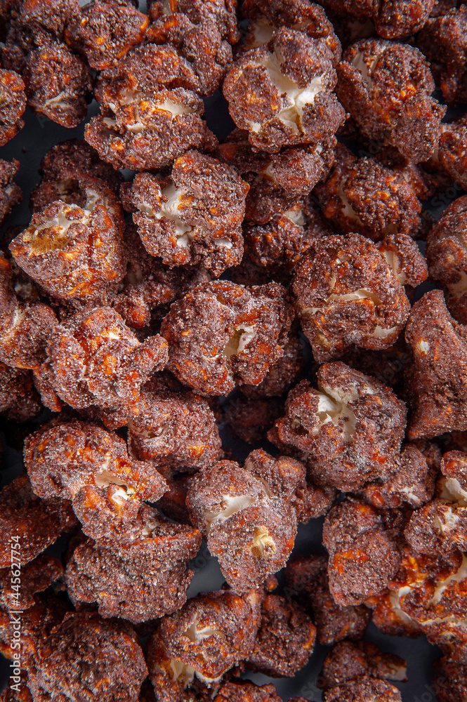Gourmet sweet popcorn in close-up photo. Chocolate flavor. Top view Gourmet sweet popcorn in close-up photo. Chocolate flavor. Top view