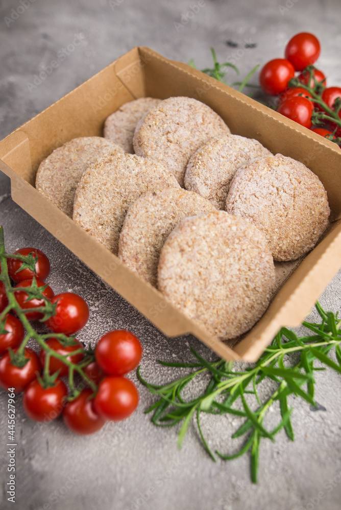 raw pork cutlets in a cardboard package raw pork cutlets in a cardboard package