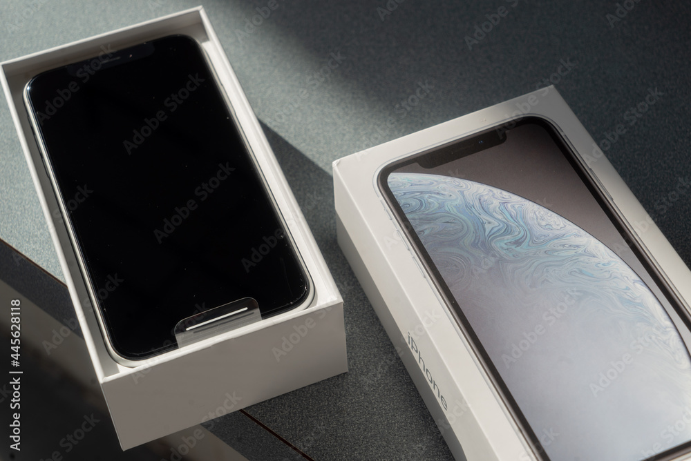 Brand new model Apple iPhone XR in open retail box, great packaging  designed in Cupertino California and now Made in India by Foxconn  Stock-Foto | Adobe Stock