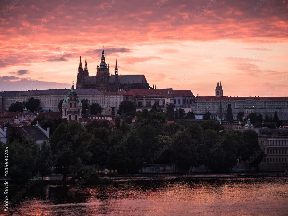 Fototapeta premium Saint Vitus Cathedral or Katedrala Svateho Vita on River Vltava in Prague, Czech Republic at Pink Sunset