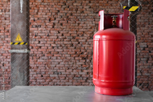 Red gas balloon on the metal workbench background. Front view. photo