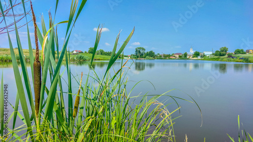 Landscape with a lake and clouds in the sky in the summer season