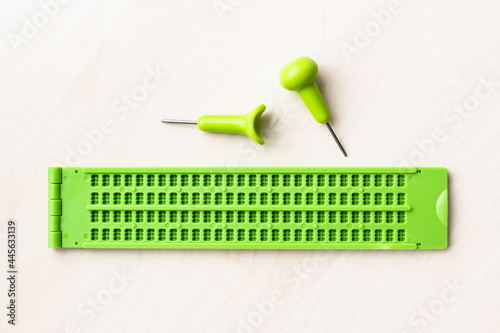 Fototapet top view of braille writing slate and stylus