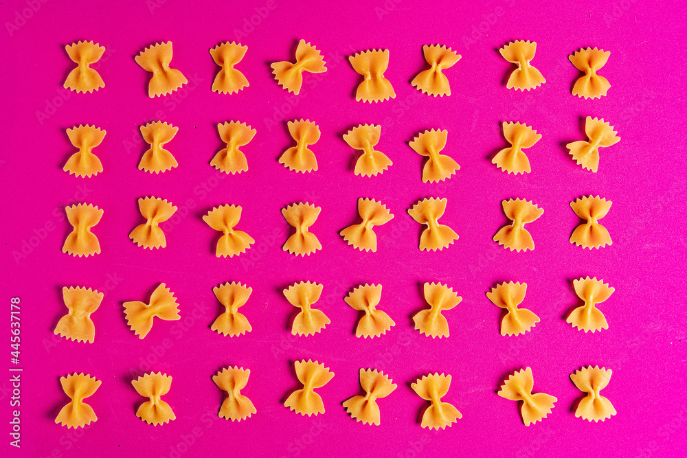 Farfalle Pasta on a pink background Farfalle Pasta on a pink background