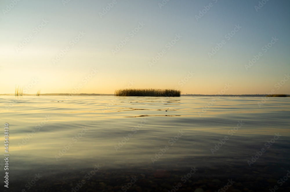 Calm beautiful view of the lake from and sky at sunrise