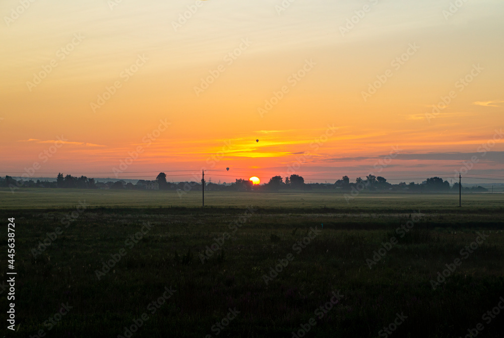 Fototapeta premium Calm beautiful sunrise over a rural field