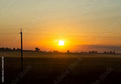 Calm beautiful sunrise over a rural field