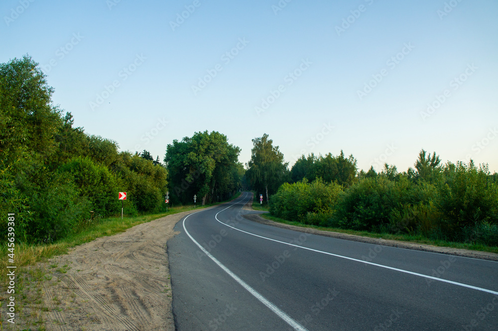 Empty road turn at dawn