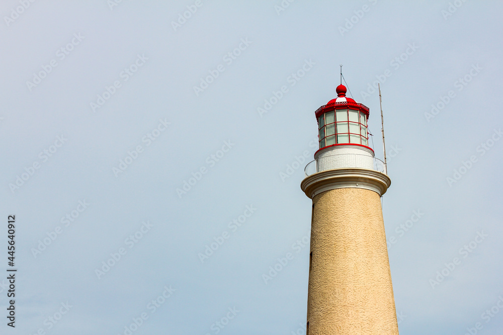red and yellow lighthouse on the coast of Atlantic Ocean in Punta del Este Uruguay