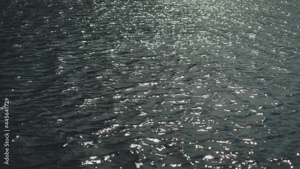 Full frame shot of waving water surface reflecting sun rays. Sea or lake in late afternoon. Natural background. Full frame shot of waving water surface reflecting sun rays. Sea or lake in late afternoon. Natural background.