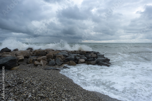 Waves on pebble beach. Storm at sea..