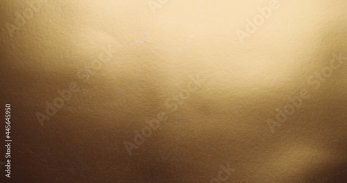 Closeup shot of a smooth gold surface for wallpapers photo