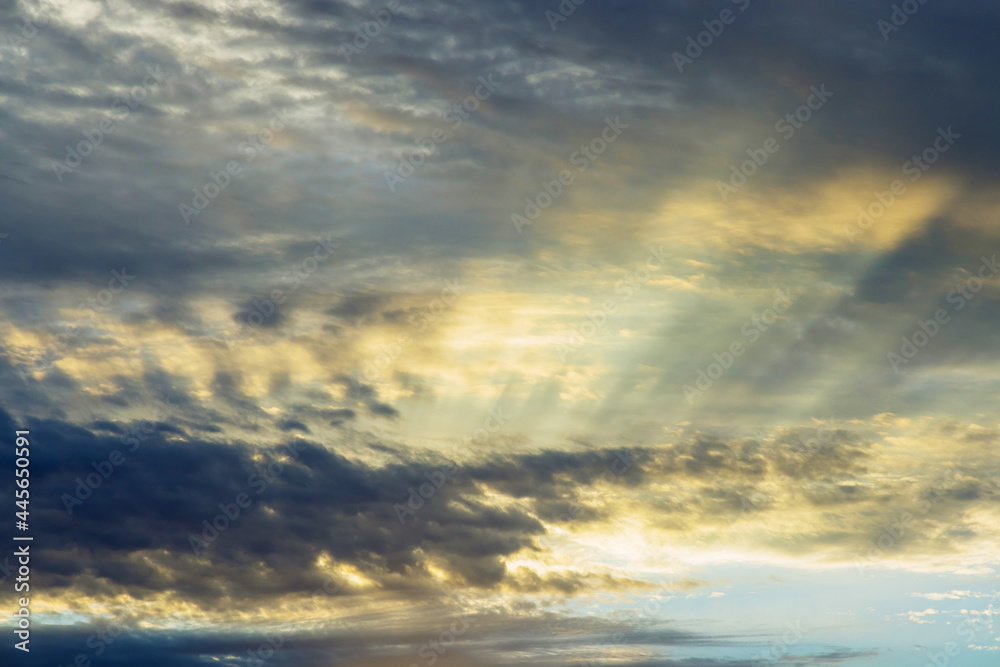 Obraz premium Dramatic soft sunrise, beautiful pink violet orange clouds against blue sky