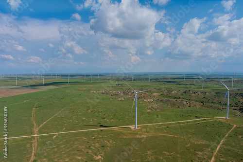 Texas landscape hills with wind turbines generator farm eco-energy