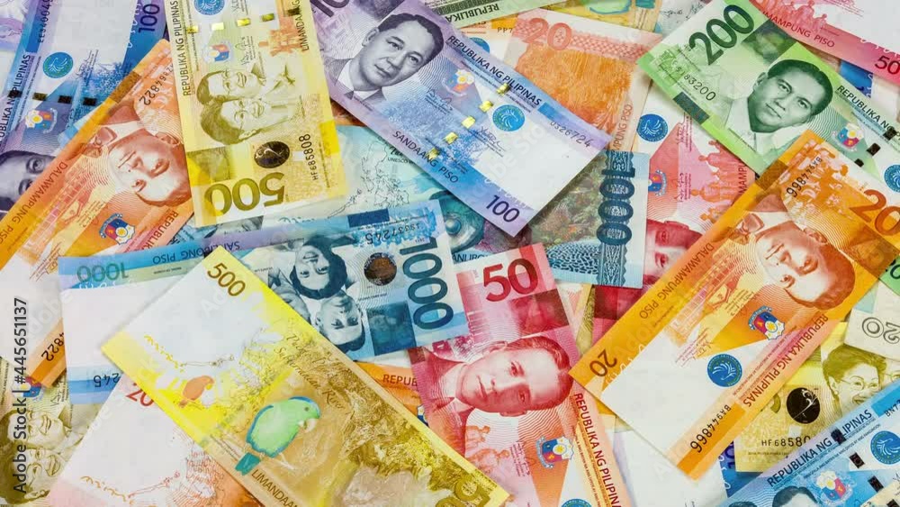 Colorful background of Philippines currency banknotes close up rotation.