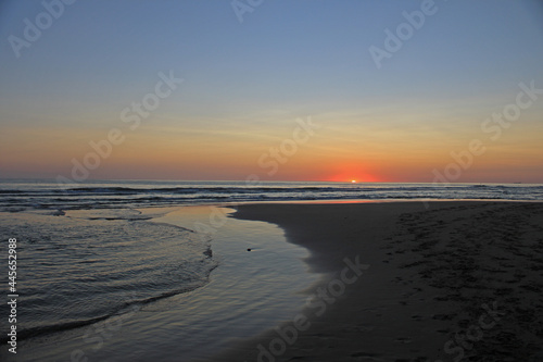 Colorful sunset on the shore of the ocean