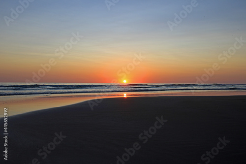 Colorful sunset on the shore of the ocean