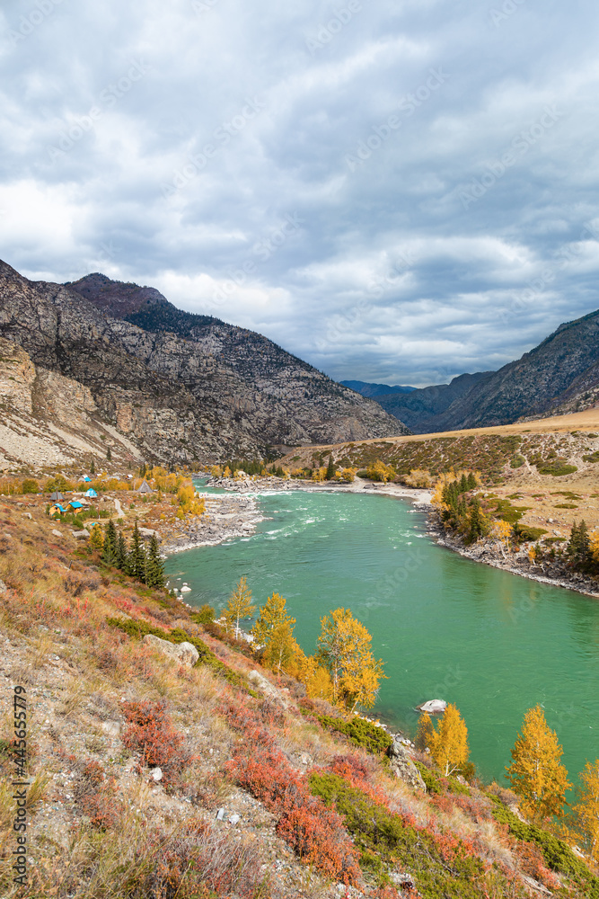 Scenic views of Turquoise Katun river and Altai mountains in autumn. Altai Republic, Russia.