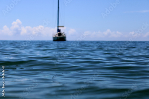boat rests on the sea on a calm day.