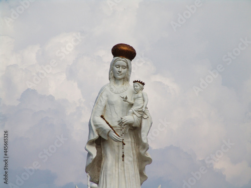 Monument to the Virgin of Chiquinquira in Maracaibo, Venezuela against a cloudy sky photo