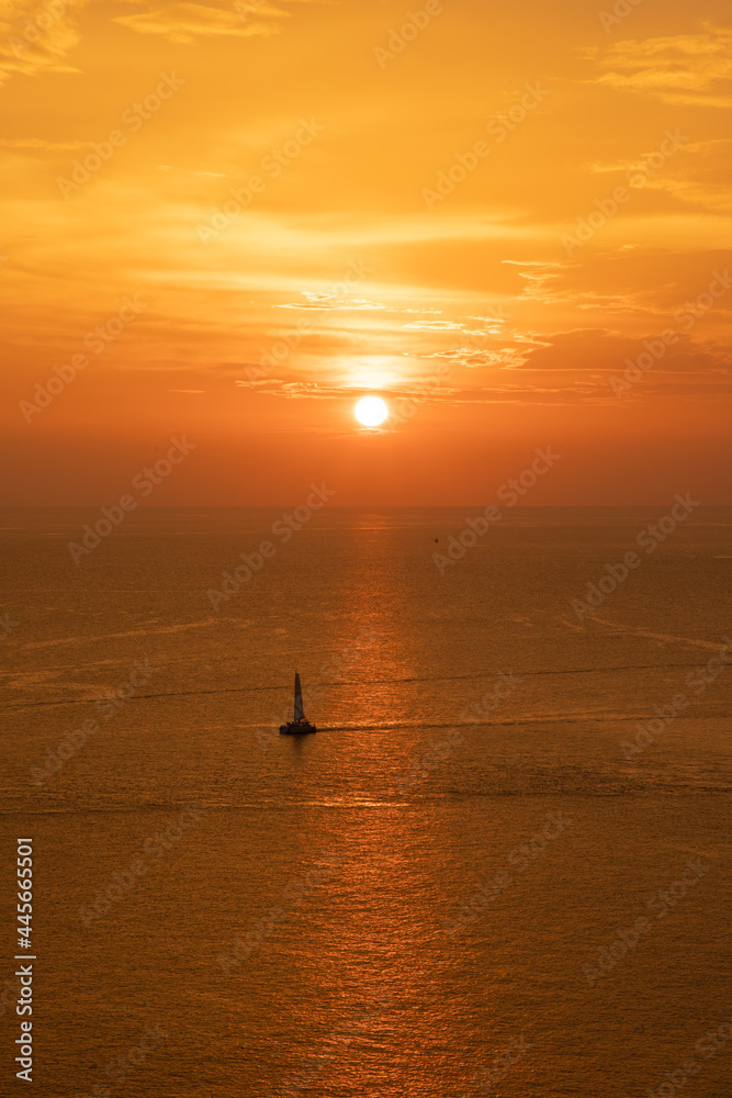 sunset sky with clouds. Dramatic sunset over the sea