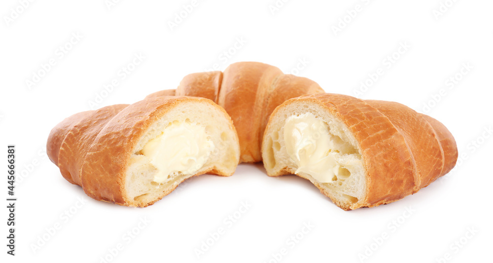 Delicious croissants with cream on white background