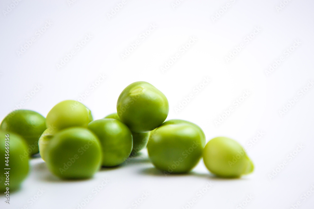 Falling green peas isolated on white background with clipping path Falling green peas isolated on white background with clipping path