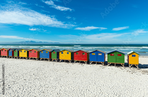 Muizenberg beach with colorful wooden beach cabins huts, Cape Town, South Africa.
