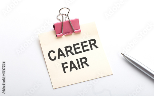CAREER FAIR text on the sticker with pen on white background