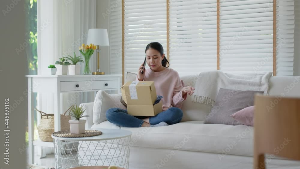 Upset mad asia people young girl consumer sit sofa at home open fake product order, damage post mail buy from online shopping retail store. Shock sad teen woman unbox from wrong bad shipping service. Upset mad asia people young girl consumer sit sofa at home open fake product order, damage post mail buy from online shopping retail store. Shock sad teen woman unbox from wrong bad shipping service.