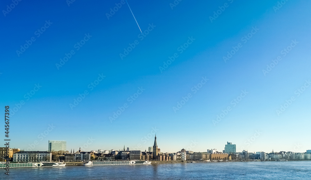 Majestic tall buildings and clear river in Cologne, Germany, long shot