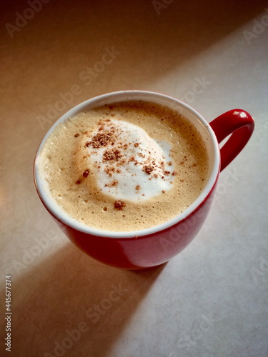 Red cup with fresh coffee