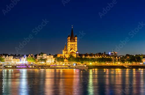 Majestic cathedral in Cologne, Germany, beautiful park by the river, night view of city. Long shot