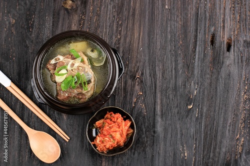 Top View Sop Buntut Korea or Korean Sokkori Gori Gomtang, Served with Kimchi. Copy Space for Text photo