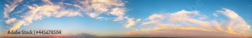 Orange clouds in blue sky, natural scenery © Wheat field