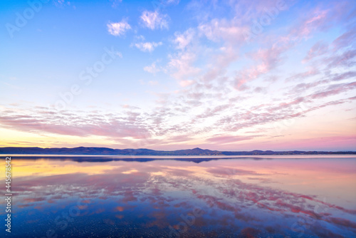 Early in the evening, Lake Bracciano (Lago di Bracciano) in Rome, Italy, colorful sky reflected in the water, beautiful natural scenery