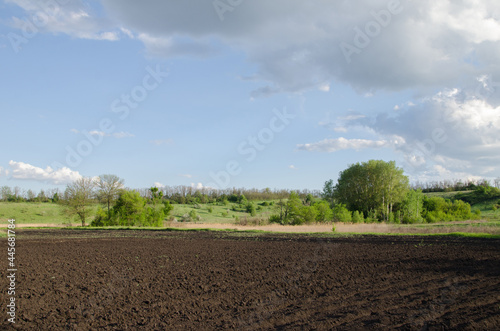 photo of rows of soil before planting. Furrow drawing in arable land prepared for spring sowing of agricultural crops. preparation for planting and growing crops.