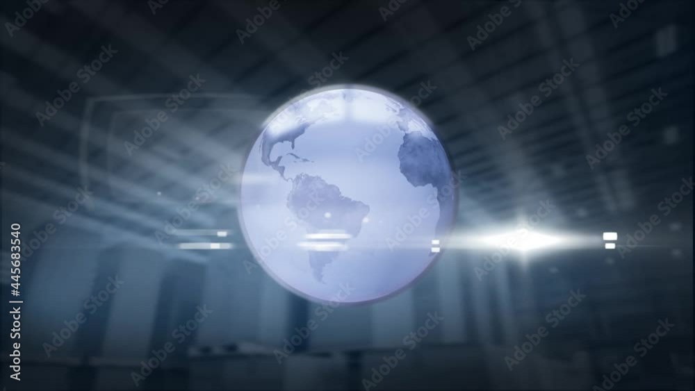 Spinning globe and spot of light against warehouse in background Spinning globe and spot of light against warehouse in background
