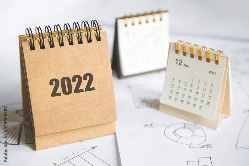 2022 Calendar and business charts on the table top view. planning and