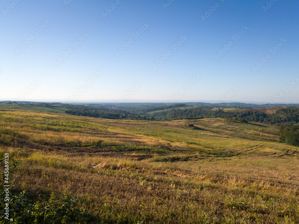 Scenic view of hilly countryside in village of Bukovica near Derventa during clear sunny summer day.