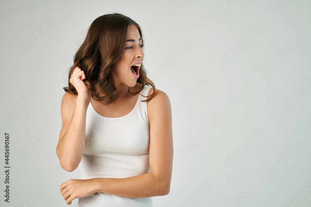 emotional brunette fashion hairstyle white tank top isolated background model emotional brunette fashion hairstyle white tank top isolated background model