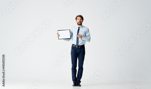 bearded man in shirt with tie papers work office