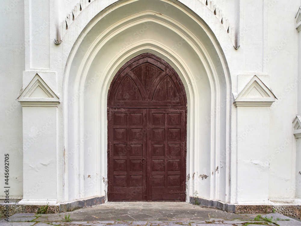 Old arched door to an old church