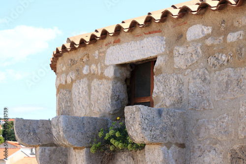 small window in the tower of the Francopan castle, island Krk, Croatia photo