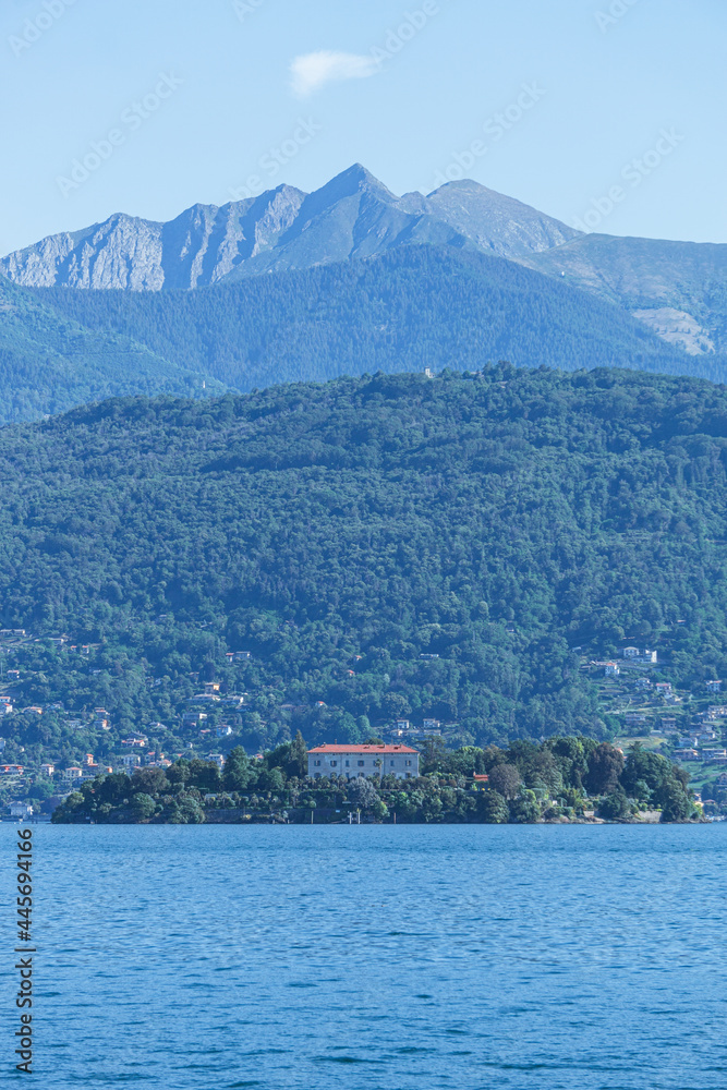 Lake maggiore during a sunny spring day near the Borromean islands and the town of Stresa, Italy - June 2021