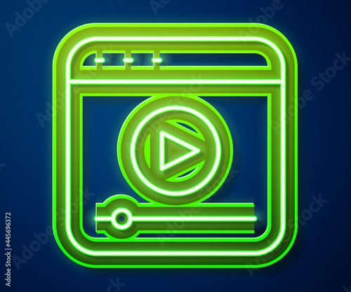 Glowing neon line Live streaming online videogame play icon isolated on blue background. Vector